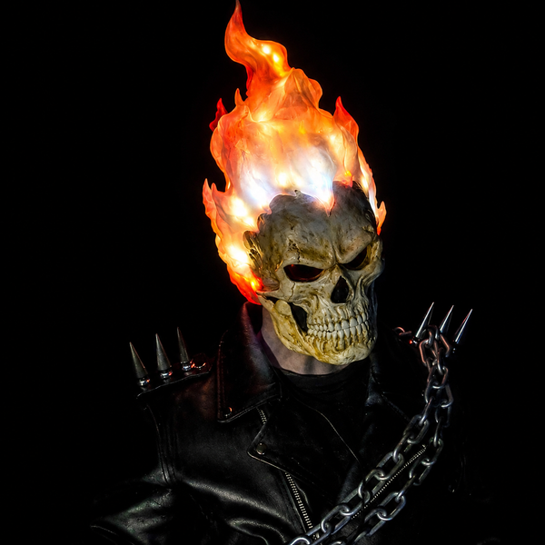 Skull mask with hair made of fire and night-vision eyes.