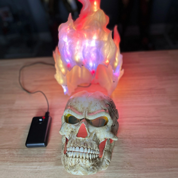 Skull mask with hair made of fire and night-vision eyes.